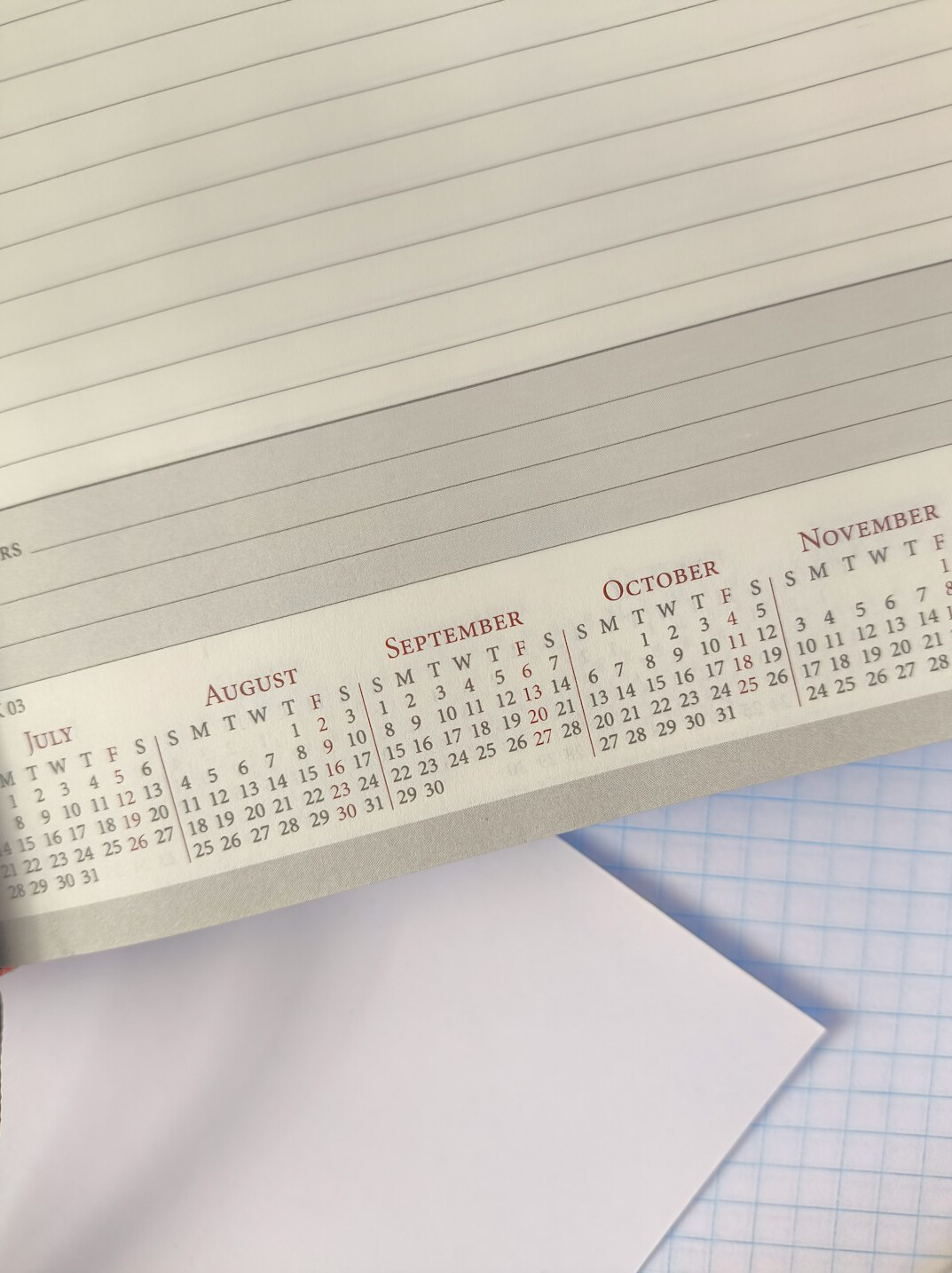 Notebook and pen on a desk with planning notes